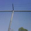 CHAIN LINK WITH BARBED WIRE